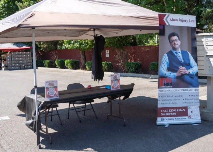 Backpack Giveaway Event - Khan Injury Law khalin chan booth